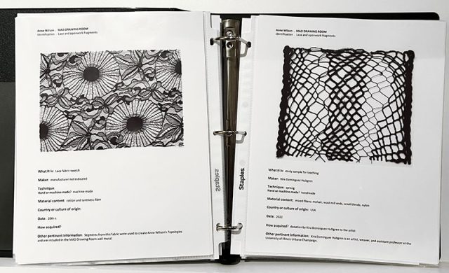 Open binder of lacework artwork on two pages